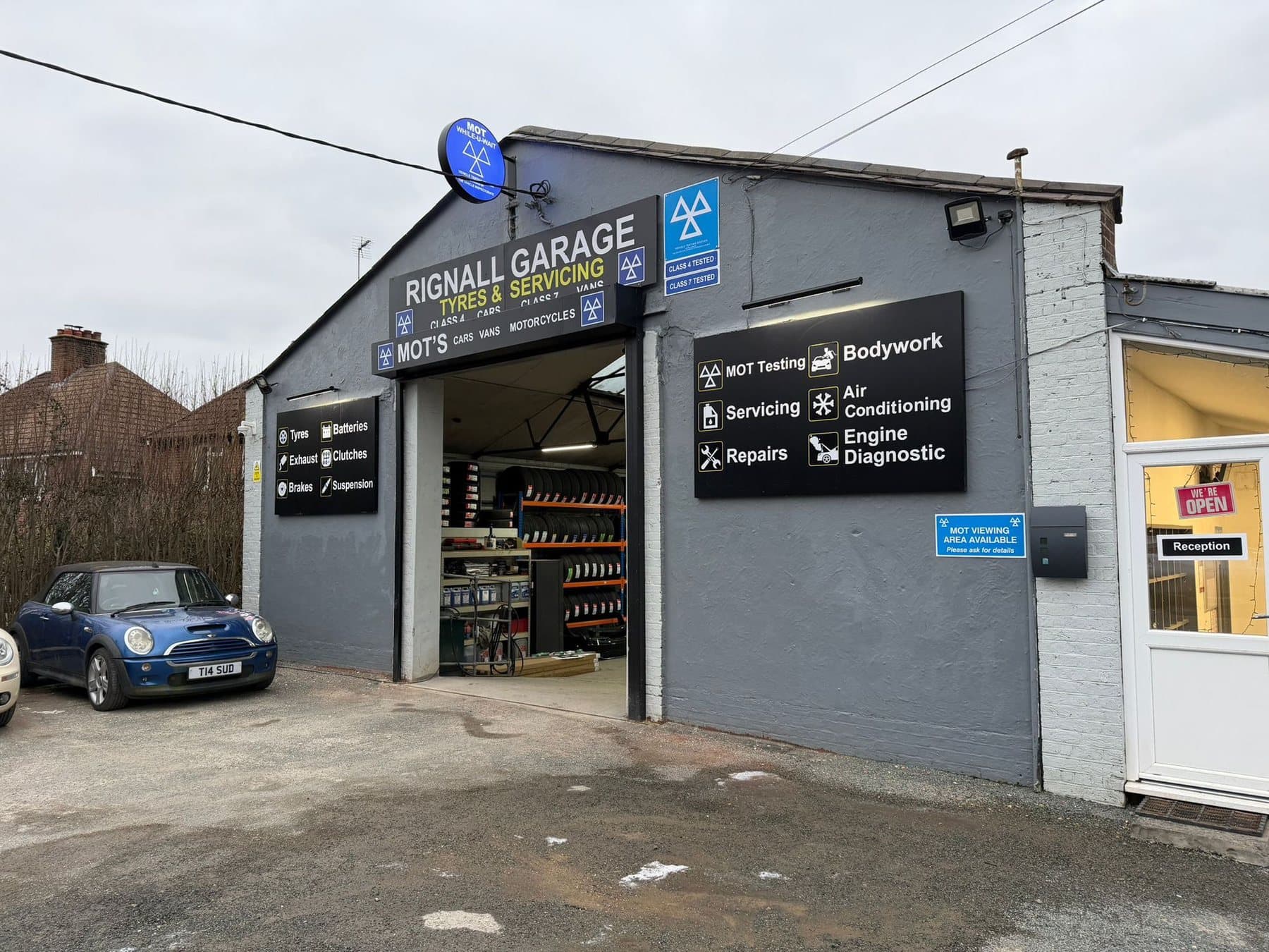 Rignall Garage shopfront on Rignall Road, Great Missenden, with MOT Class 4 and 7 signage above the workshop entrance